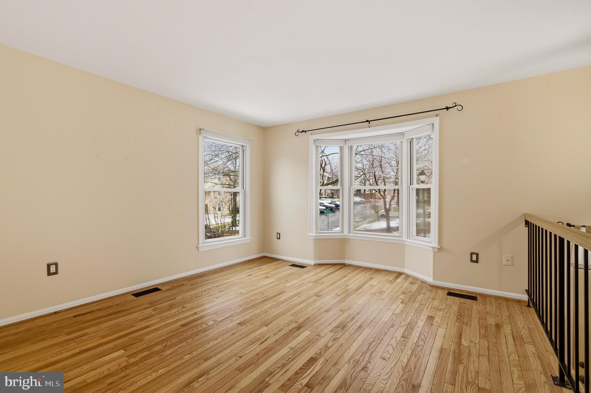 2036 Howard Chapel Turn Crofton, MD 21114 - Photo 7 of 55 a view of an empty room with wooden floor and a window
