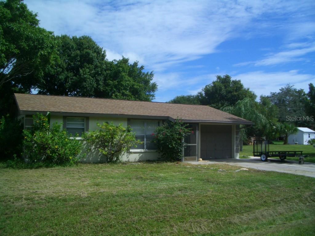 855 Rosedale Road Venice, FL 34293 - Photo 1 of 1 a view of a house with backyard and garden