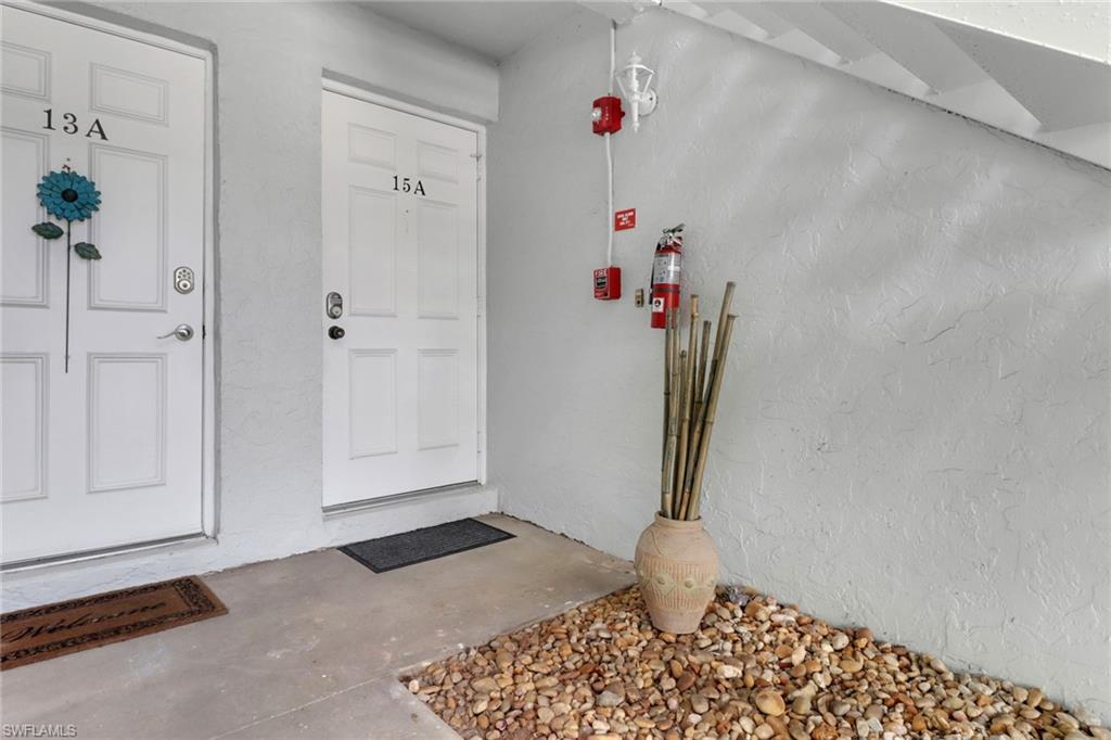 7077 Quail Run Court East, Unit A 15 Fort Myers, FL 33908 - Photo 12 of 43 a view of an entryway with wooden floor