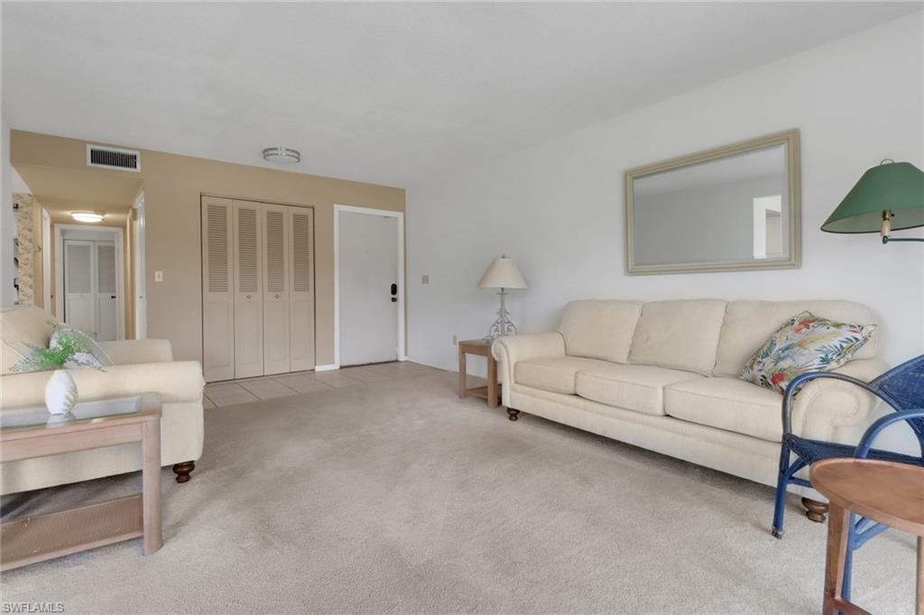 7077 Quail Run Court East, Unit A 15 Fort Myers, FL 33908 - Photo 14 of 43 a living room with furniture and a potted plant