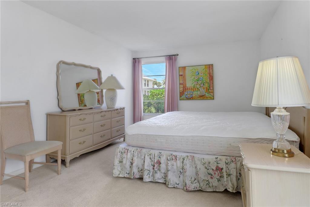 7077 Quail Run Court East, Unit A 15 Fort Myers, FL 33908 - Photo 25 of 43 a bedroom with a bed and a dresser