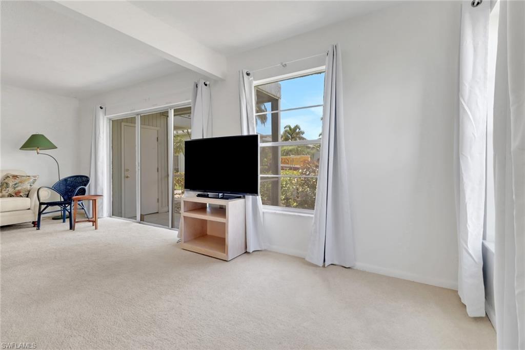 7077 Quail Run Court East, Unit A 15 Fort Myers, FL 33908 - Photo 5 of 43 a living room with furniture and a flat screen tv