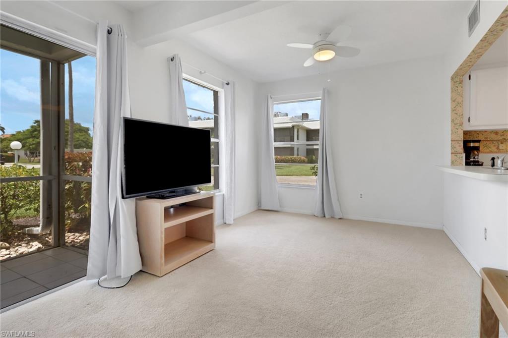 7077 Quail Run Court East, Unit A 15 Fort Myers, FL 33908 - Photo 6 of 43 a living room with furniture and a flat screen tv
