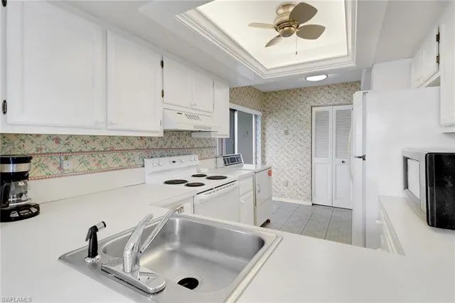 a kitchen with a cabinets and a stove top oven