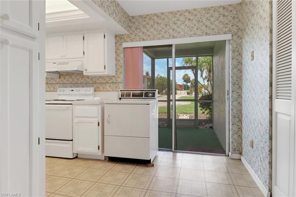 7077 Quail Run Court East, Unit A 15 Fort Myers, FL 33908 - Photo 9 of 43 a kitchen with a cabinets and a stove top oven