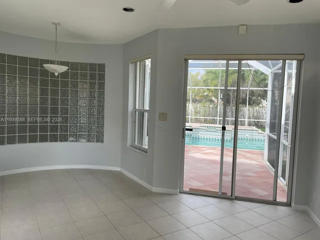 a view of an empty room with a fireplace