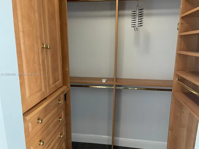 a bathroom with a bathtub and a window