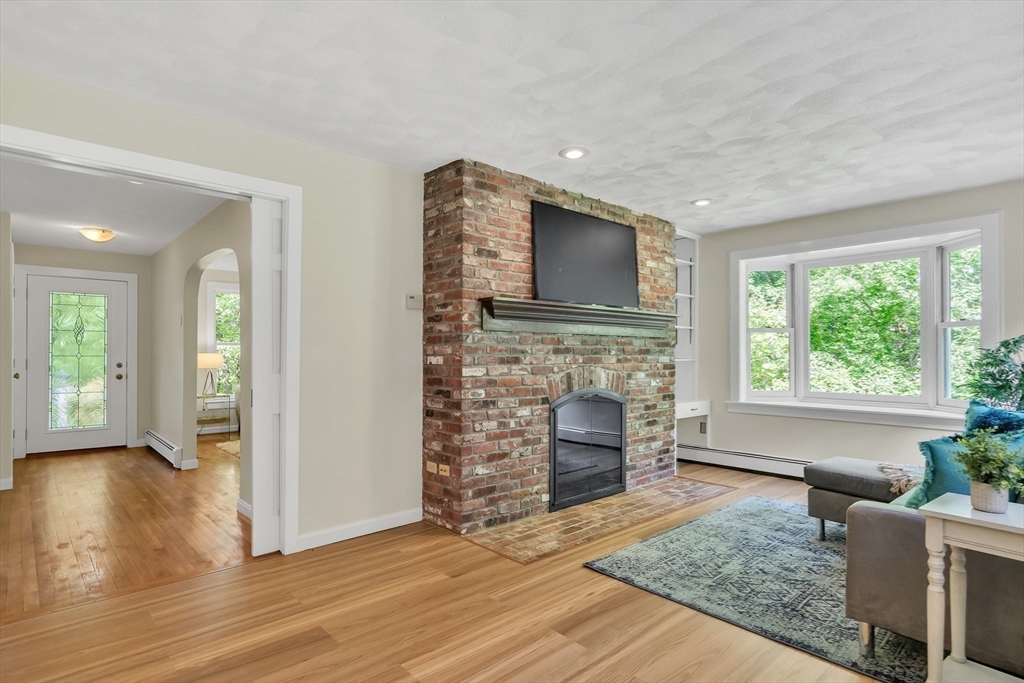 71 Grassland Street Lexington, MA 02421 - Photo 12 of 38 a living room with furniture and a fireplace