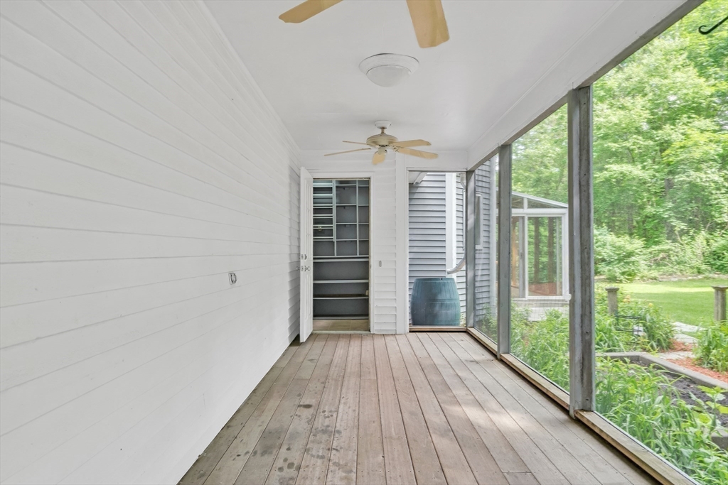 71 Grassland Street Lexington, MA 02421 - Photo 23 of 38 a view of hallway with a large window and wooden floor