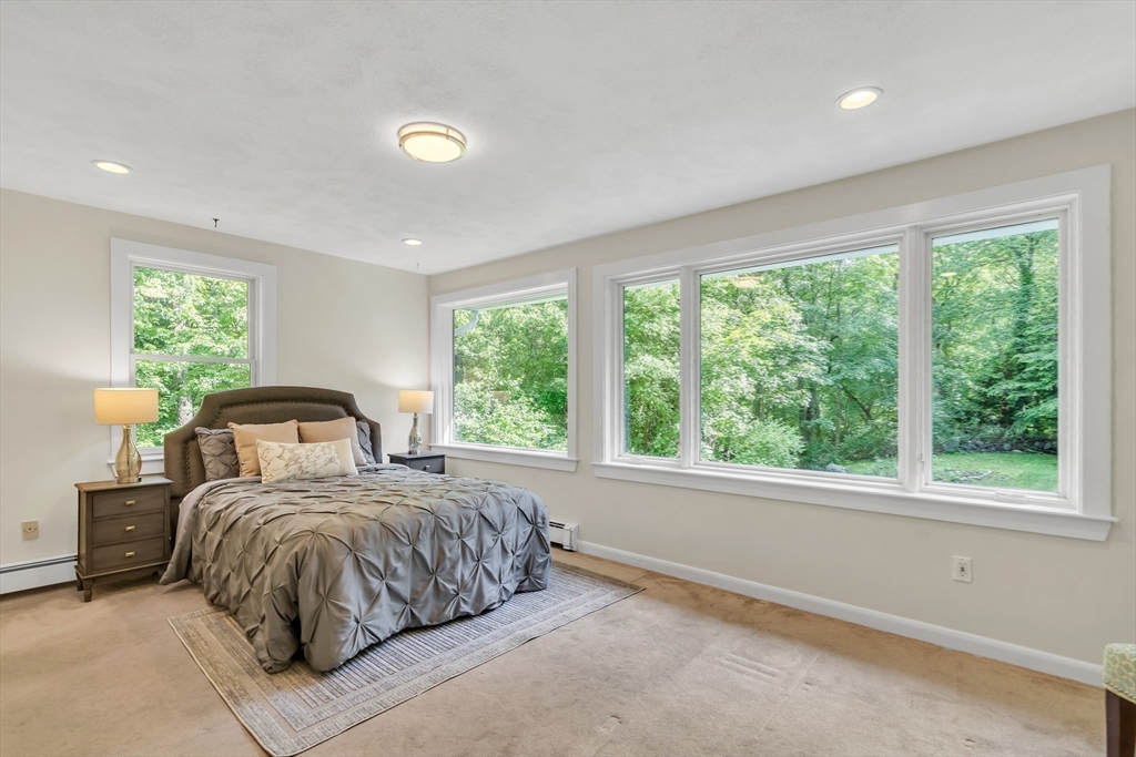 71 Grassland Street Lexington, MA 02421 - Photo 24 of 38 a bedroom with a bed and a large window
