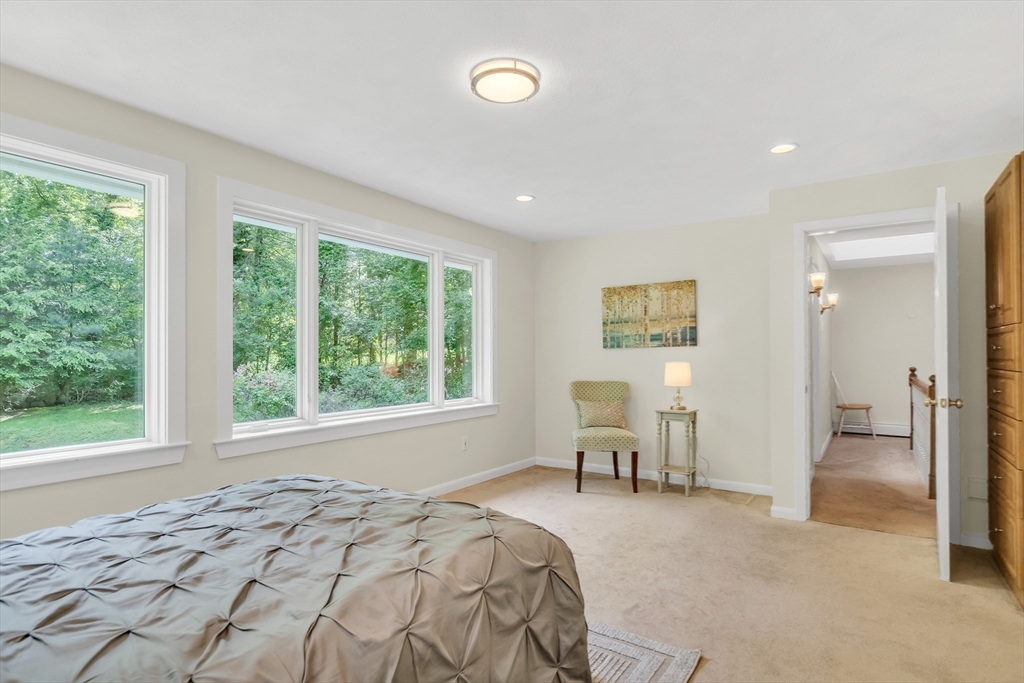 71 Grassland Street Lexington, MA 02421 - Photo 26 of 38 a bedroom with a bed and large windows