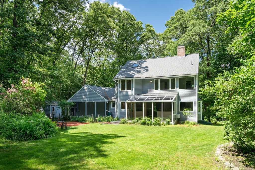 71 Grassland Street Lexington, MA 02421 - Photo 4 of 38 a front view of a house with a garden