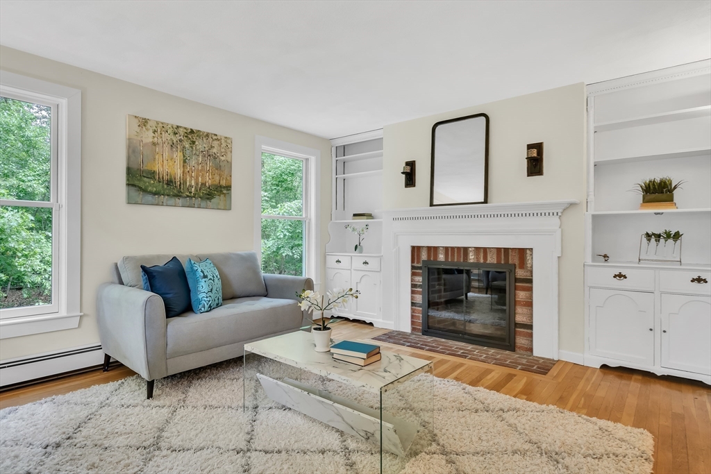 71 Grassland Street Lexington, MA 02421 - Photo 6 of 38 a living room with furniture and a fireplace