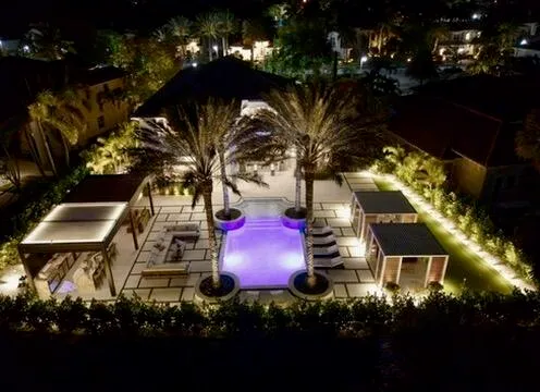 a view of a house with a yard and garden