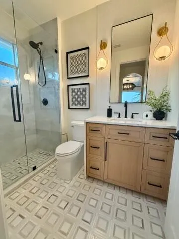 a spacious bathroom with a sink toilet and shower