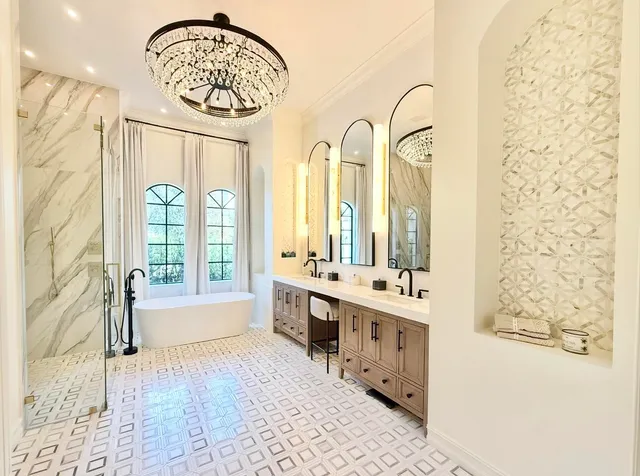 a large bathroom with a tub sink shower and mirror