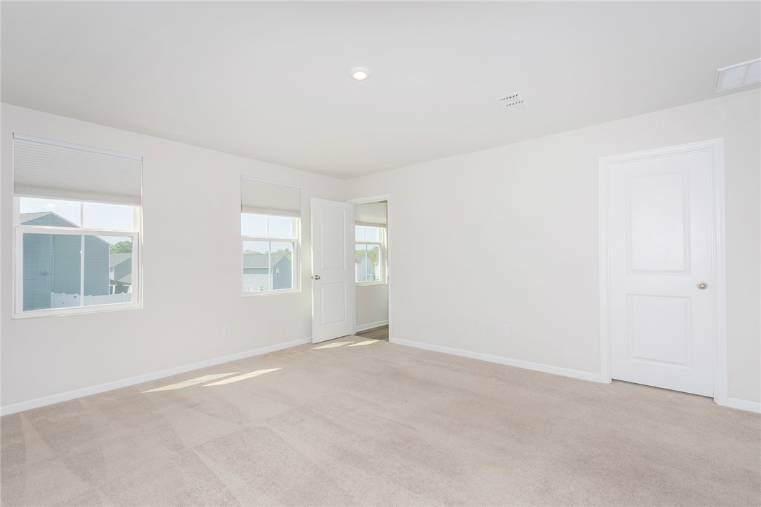 132 Bleckley Trail Anderson, SC 29625 - Photo 14 of 44 This spacious room offers comfort and versatility, featuring ample natural light and plush carpeting.