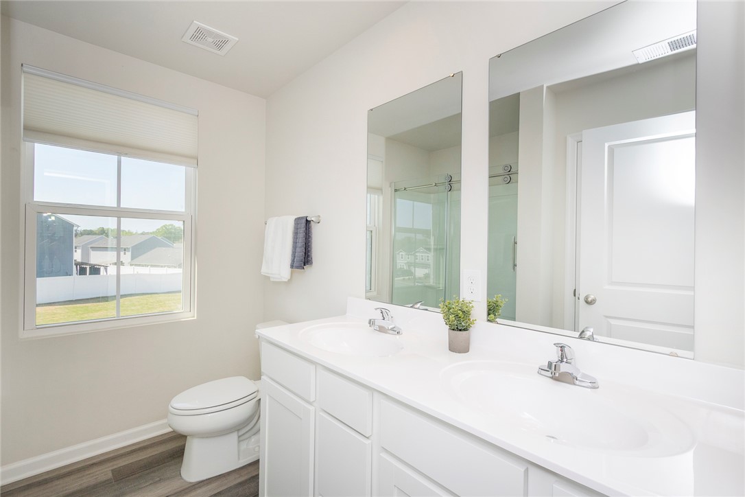 132 Bleckley Trail Anderson, SC 29625 - Photo 27 of 44 This spacious bathroom features a double vanity and a window offering natural light.