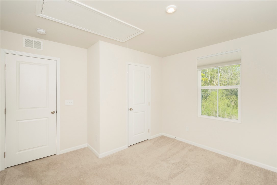 132 Bleckley Trail Anderson, SC 29625 - Photo 29 of 44 This airy bedroom offers a serene escape with natural light and soft carpeting.