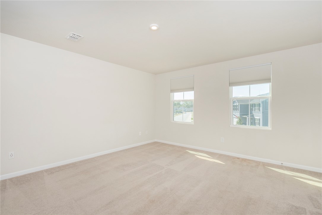 132 Bleckley Trail Anderson, SC 29625 - Photo 30 of 44 This spacious room offers natural light and a soft carpeted floor.