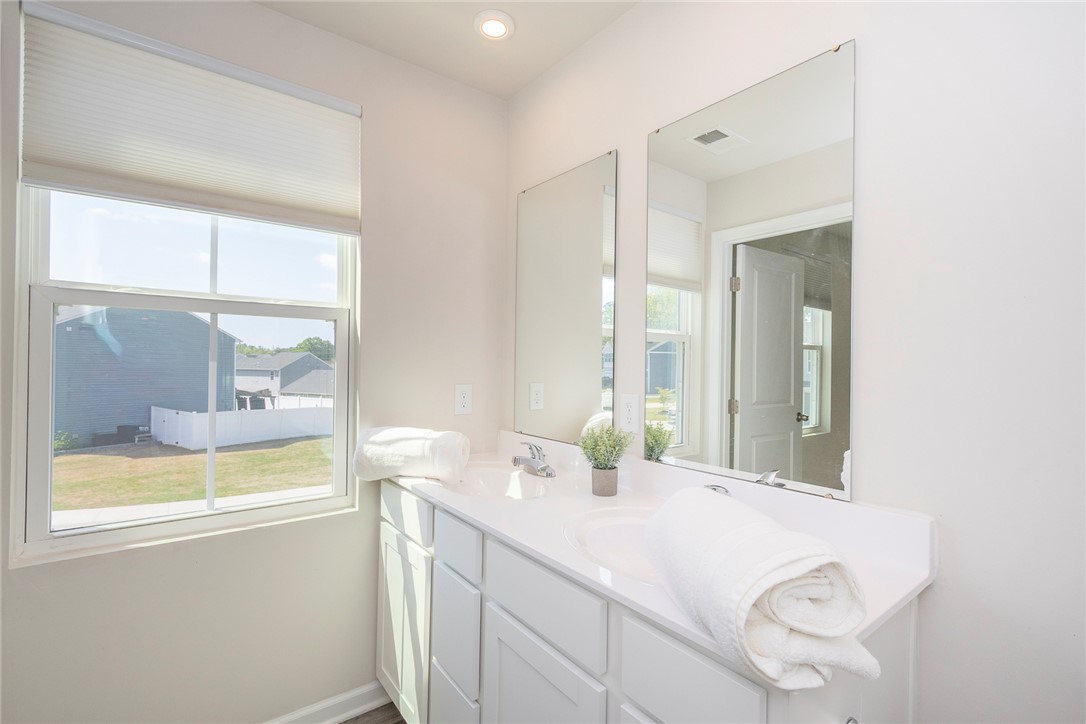 132 Bleckley Trail Anderson, SC 29625 - Photo 32 of 44 This bright bathroom features a spacious vanity with dual sinks, offering both style and functionality.