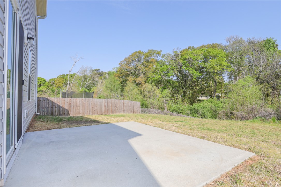132 Bleckley Trail Anderson, SC 29625 - Photo 34 of 44 This private backyard features a spacious patio, perfect for outdoor enjoyment and serene views.