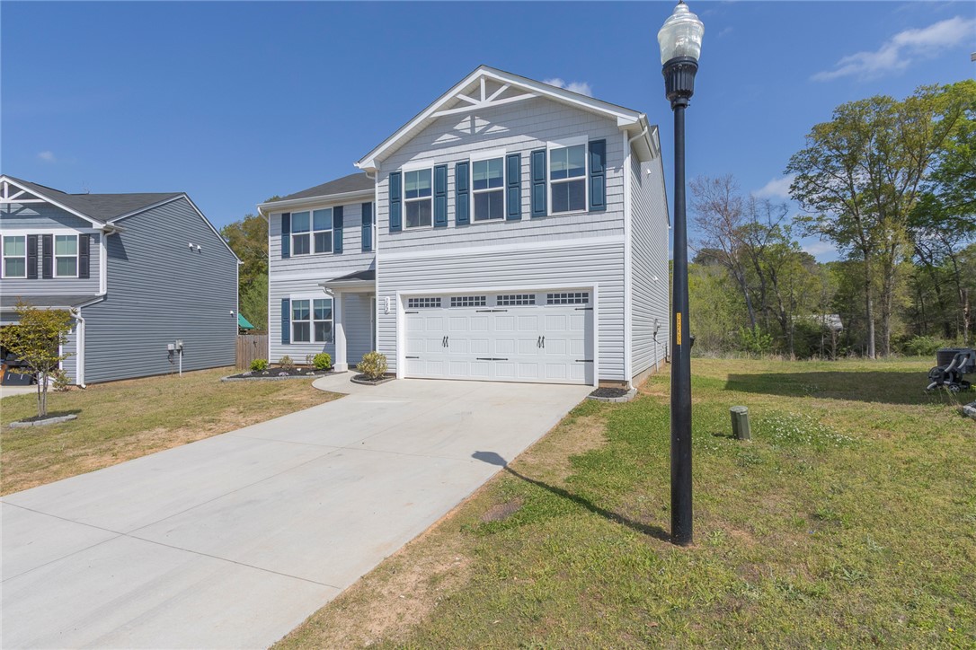 132 Bleckley Trail Anderson, SC 29625 - Photo 36 of 44 This charming home offers a spacious garage and ample parking, blending comfort with convenience.