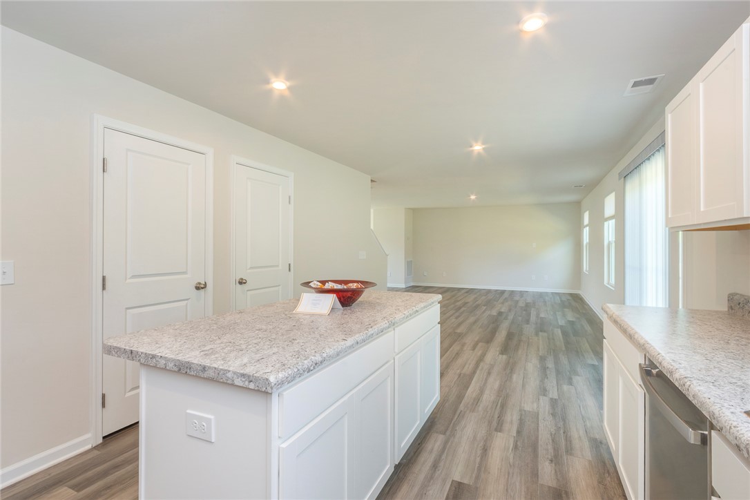 132 Bleckley Trail Anderson, SC 29625 - Photo 4 of 44 This open concept kitchen flows seamlessly into the living space, perfect for modern living.