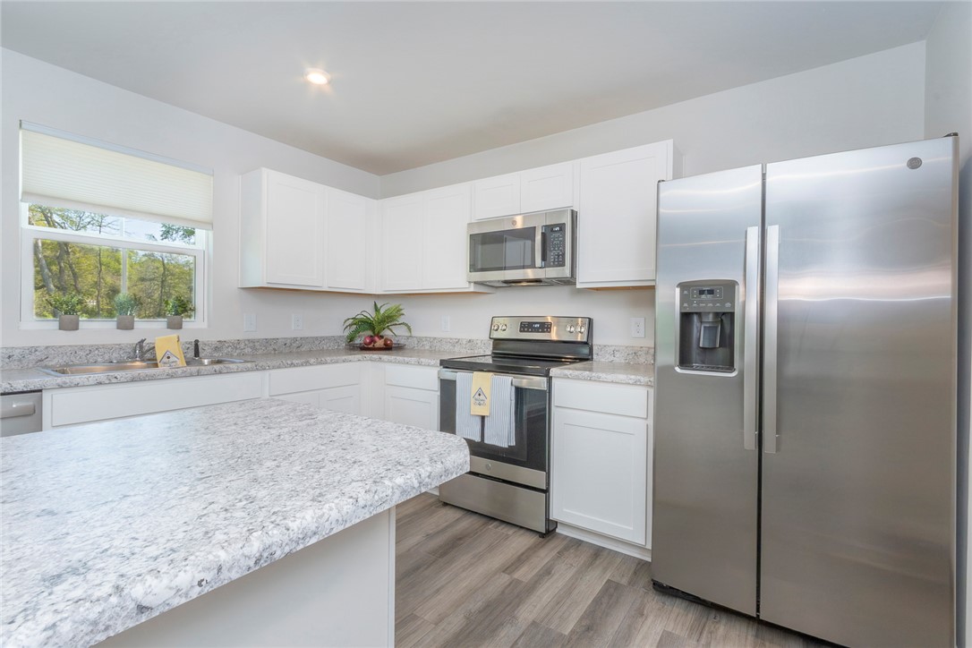 132 Bleckley Trail Anderson, SC 29625 - Photo 41 of 44 This modern kitchen features sleek countertops, stainless steel appliances, and ample cabinetry for all your culinary needs.
