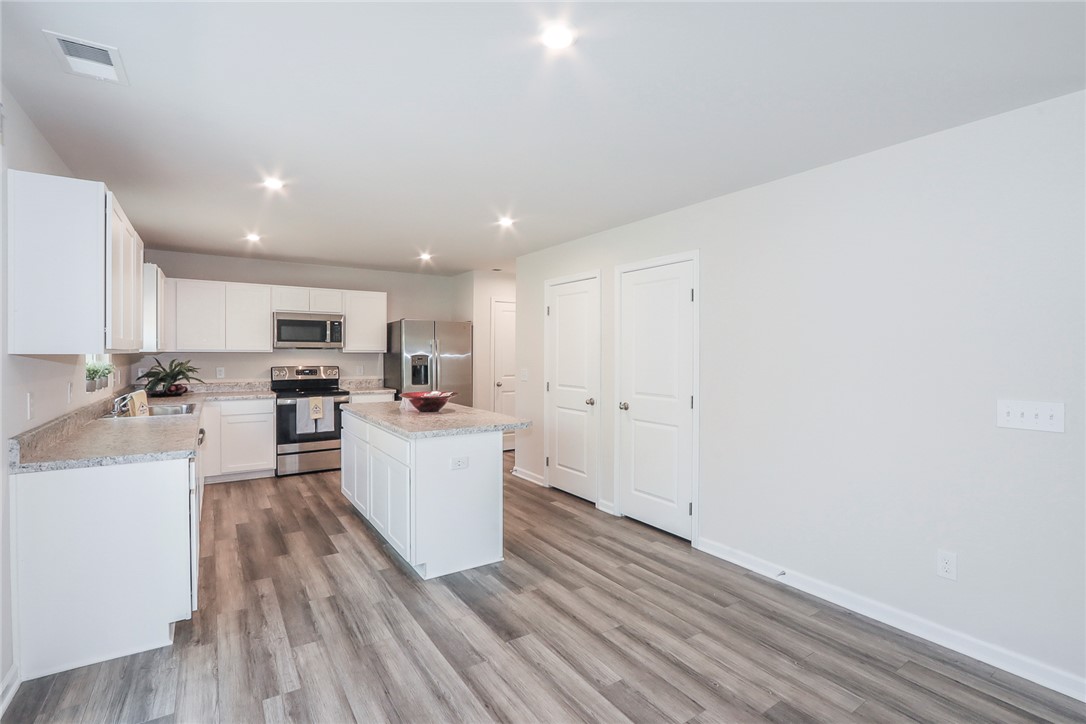 132 Bleckley Trail Anderson, SC 29625 - Photo 44 of 44 This spacious kitchen offers a functional island, ample counter space, and modern appliances.