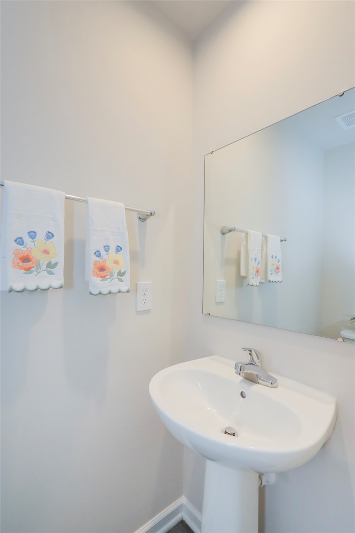 132 Bleckley Trail Anderson, SC 29625 - Photo 5 of 44 This clean and bright bathroom features a pedestal sink and a large mirror.