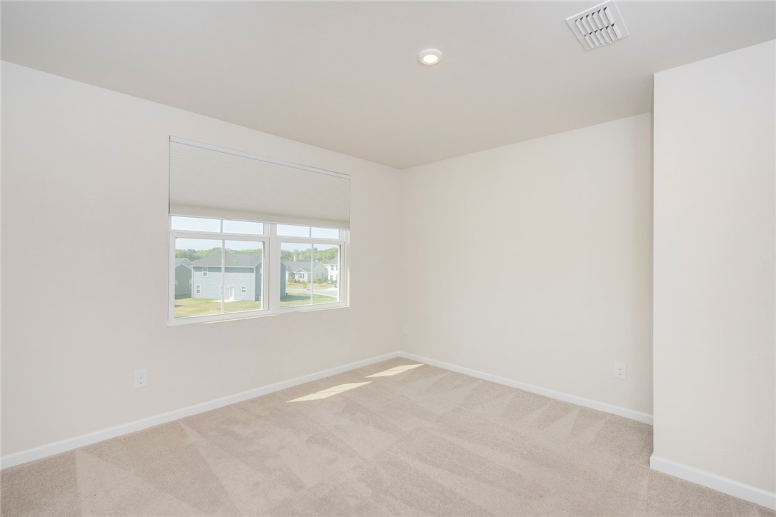 132 Bleckley Trail Anderson, SC 29625 - Photo 7 of 44 This bright, airy room offers a blank canvas for your personal touch, featuring soft carpet and ample natural light.