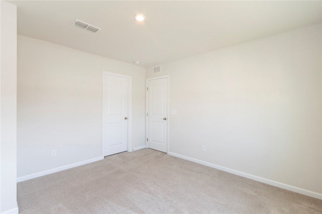 132 Bleckley Trail Anderson, SC 29625 - Photo 8 of 44 This spacious room features neutral tones and ample natural light, creating a bright and inviting atmosphere.