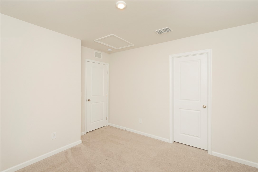 132 Bleckley Trail Anderson, SC 29625 - Photo 9 of 44 This spacious room features neutral tones and soft carpeting, creating a versatile blank canvas.