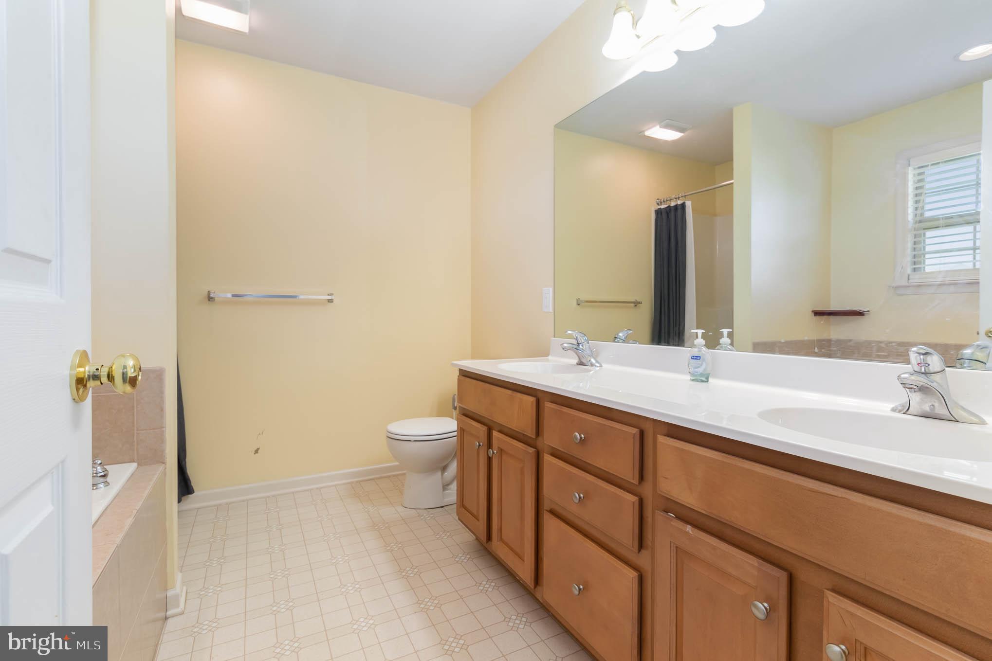 471 Nursery Drive North Mechanicsburg, PA 17055 - Photo 17 of 25 a bathroom with a double vanity sink toilet and shower