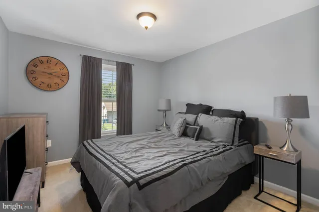 a bedroom with a bed and a chair