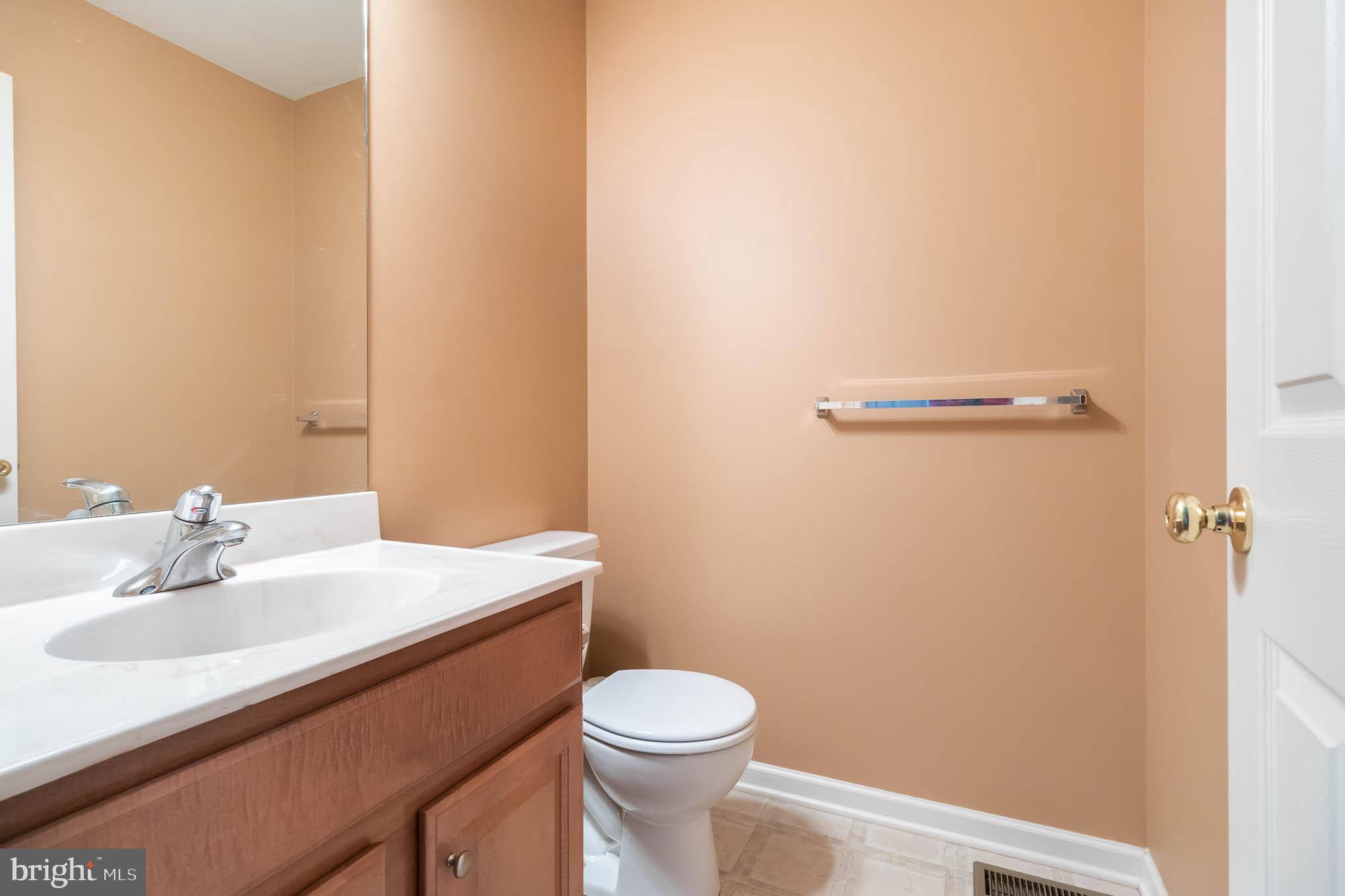 471 Nursery Drive North Mechanicsburg, PA 17055 - Photo 3 of 25 a bathroom with a sink a toilet and a mirror