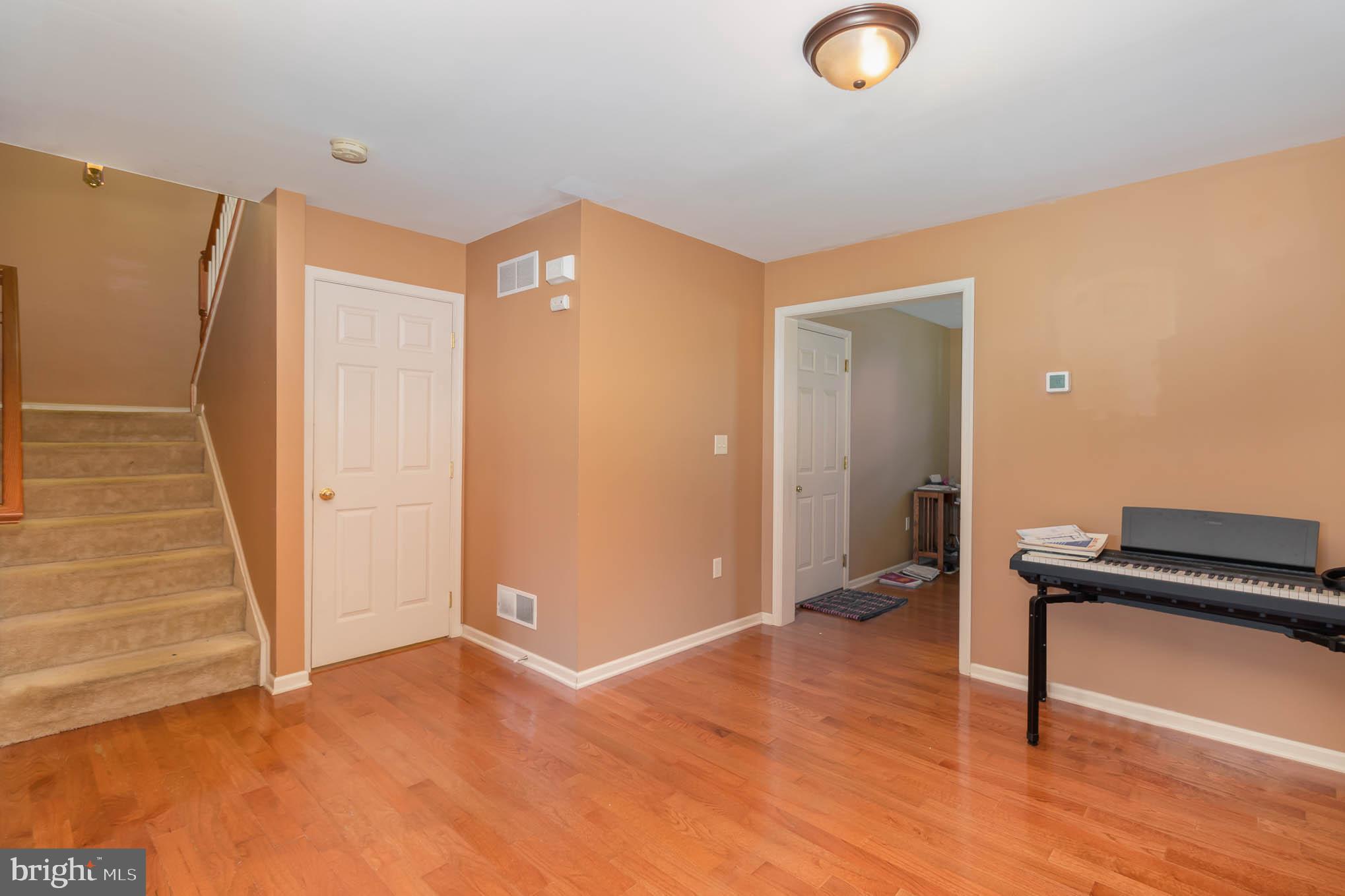 471 Nursery Drive North Mechanicsburg, PA 17055 - Photo 6 of 25 a view of an empty room with wooden floor and a window