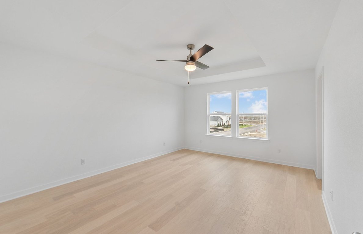400 Sullivan Way Elgin, TX 78621 - Photo 13 of 30 an empty room with a window and a fan