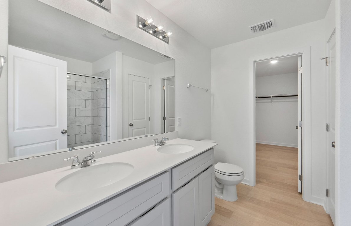 400 Sullivan Way Elgin, TX 78621 - Photo 16 of 30 a bathroom with a sink a toilet and shower