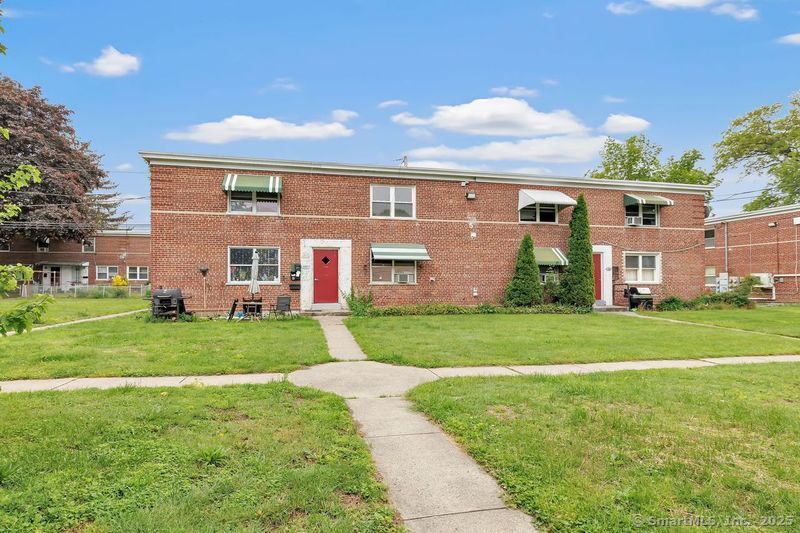 367 D Building 5 Granfield Avenue Bridgeport, CT 06610 - Photo 1 of 13 front view of a house with a yard