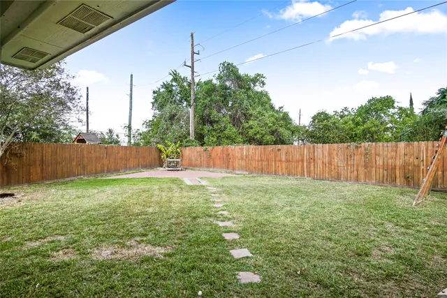 a view of a backyard with a plants and trees
