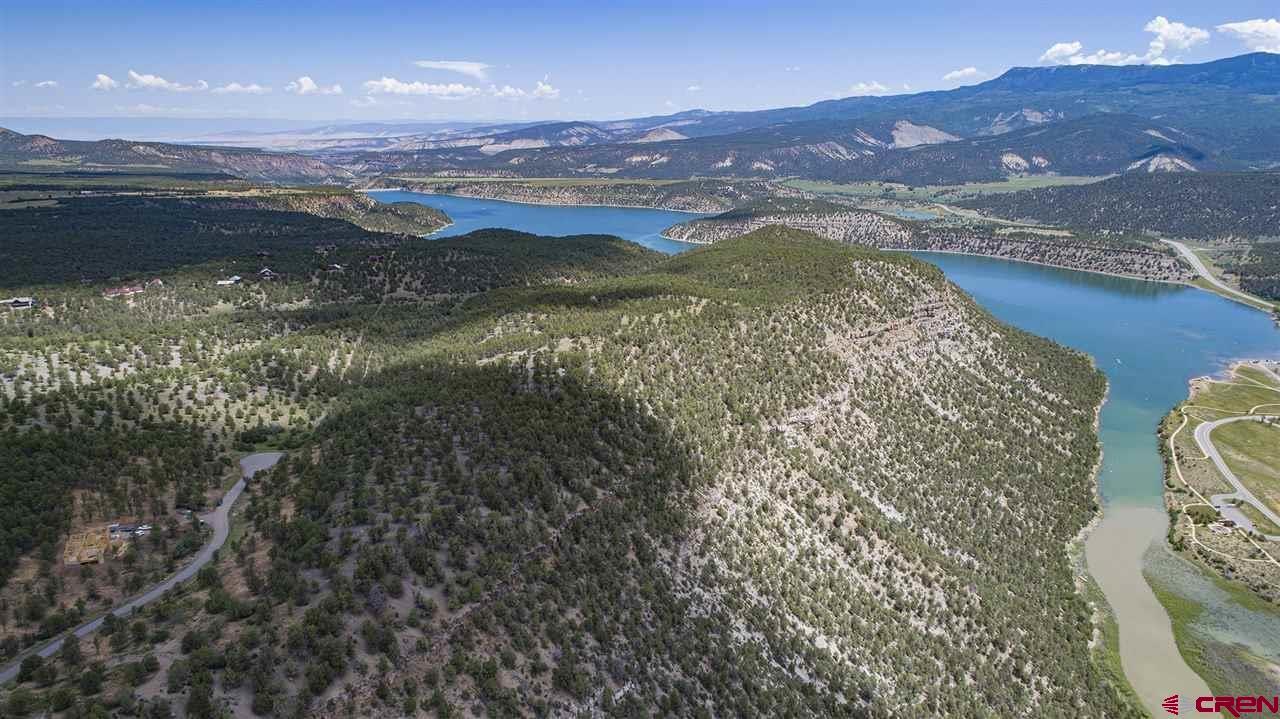 Tbd Lot 3 Tbd Way Ridgway, CO 81432 - Photo 10 of 12 a view of a city with mountains in the background
