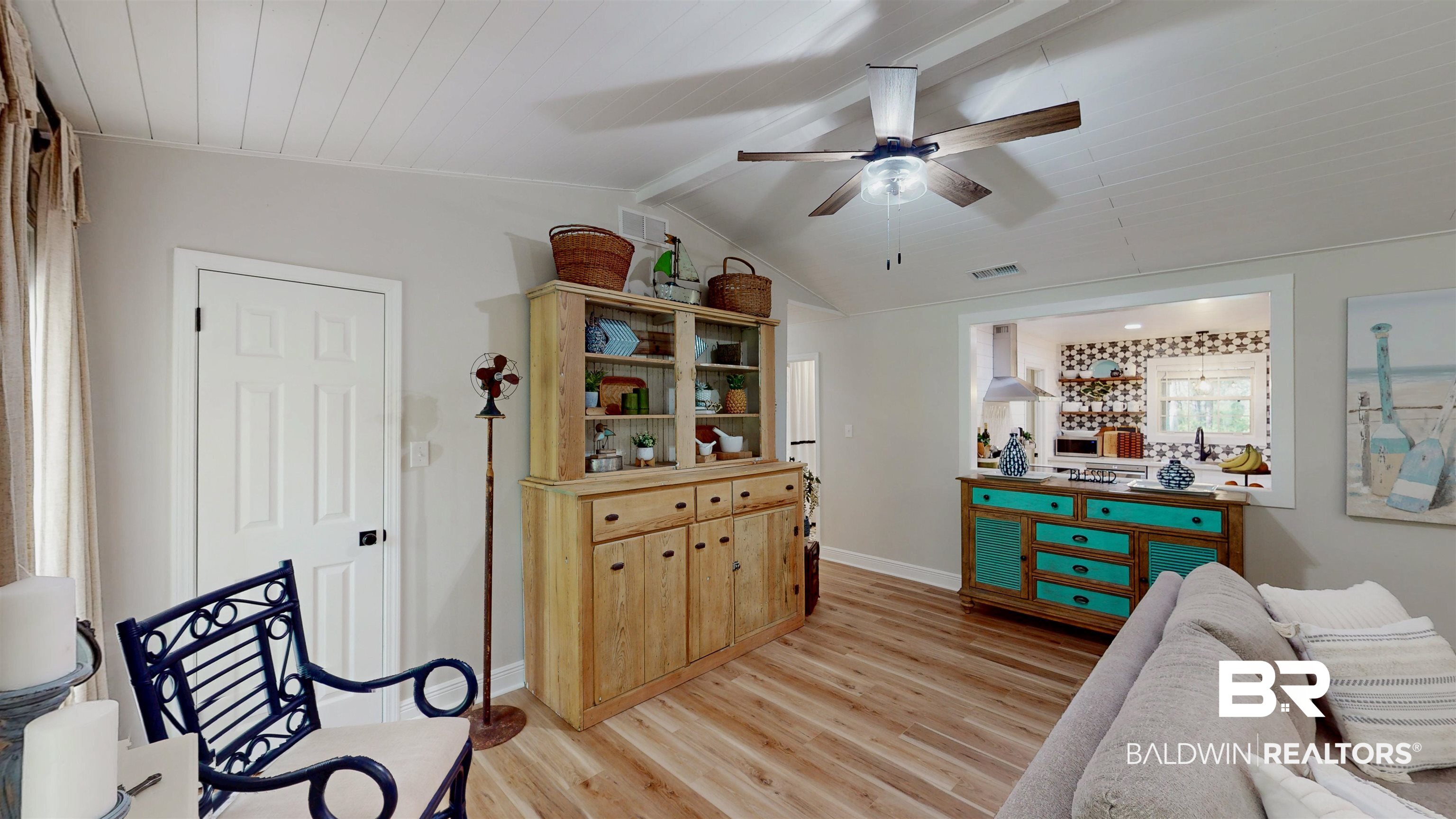 9902 Clarke Ridge Road Foley, AL 36535 - Photo 13 of 61 Interior space with light wood finished floors, vaulted ceiling with beams, baseboards, visible vents, and a ceiling fan