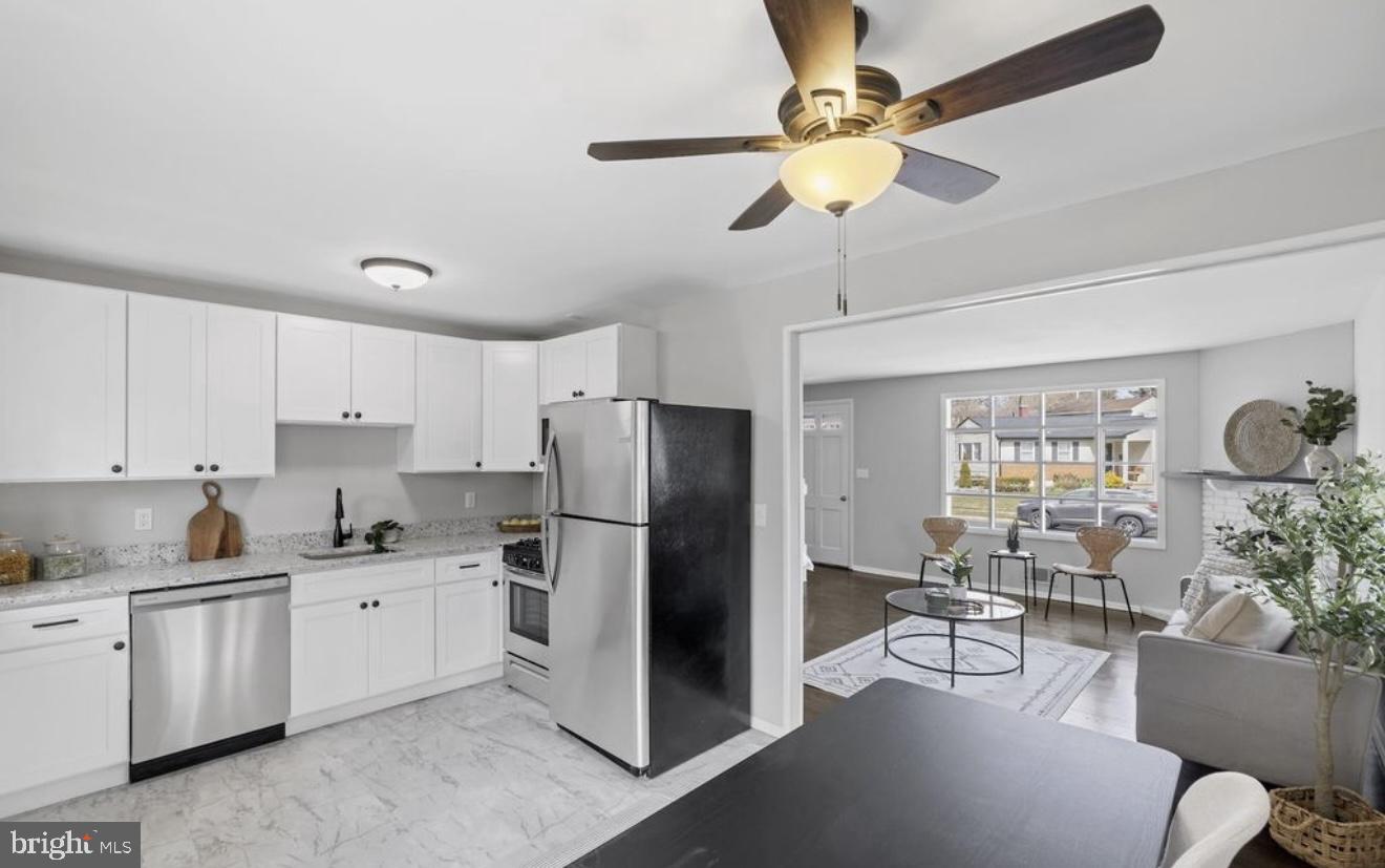 243 Highmeadow Road Reisterstown, MD 21136 - Photo 16 of 32 Modern kitchen with open layout charm.