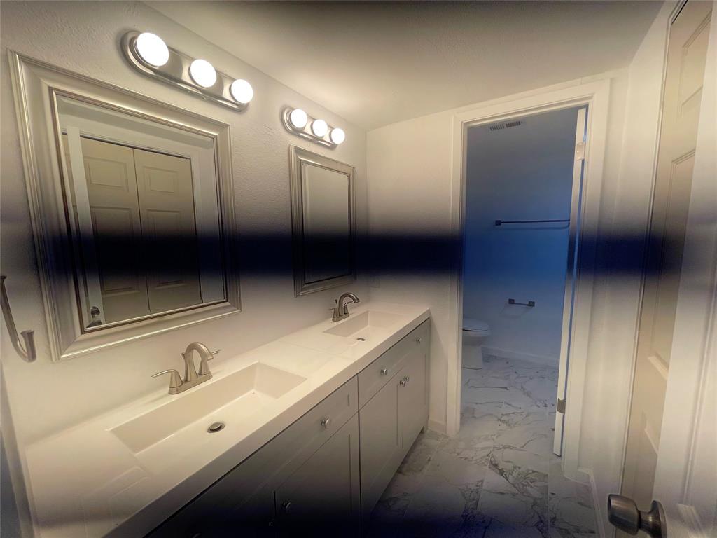 3 Ridge Drive Hickory Creek, TX 75065 - Photo 17 of 20 a bathroom with double vanity and mirrors