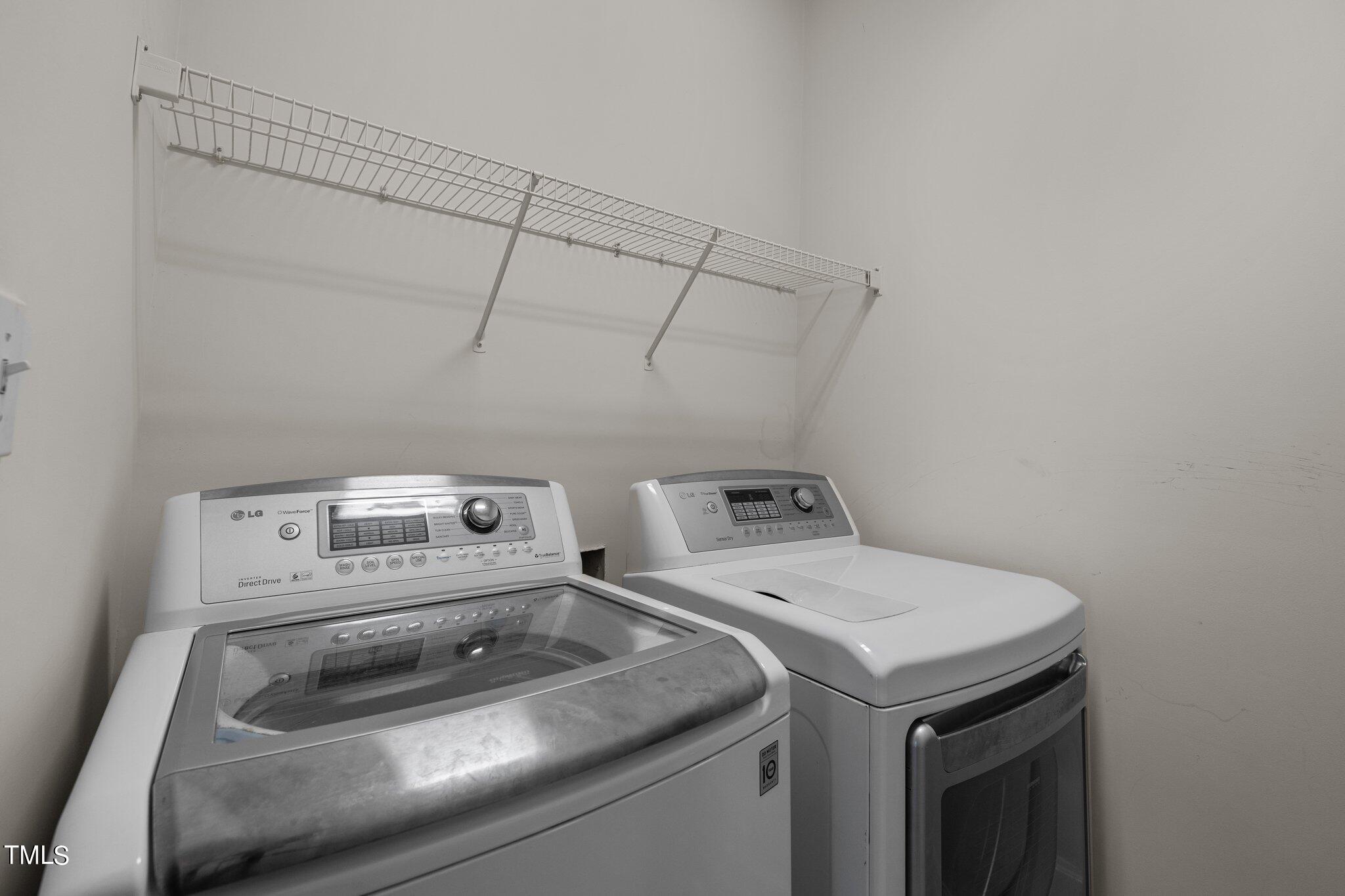 1710 Tiffany Bay Court, Unit 301 Raleigh, NC 27609 - Photo 15 of 36 a utility room with dryer and washer