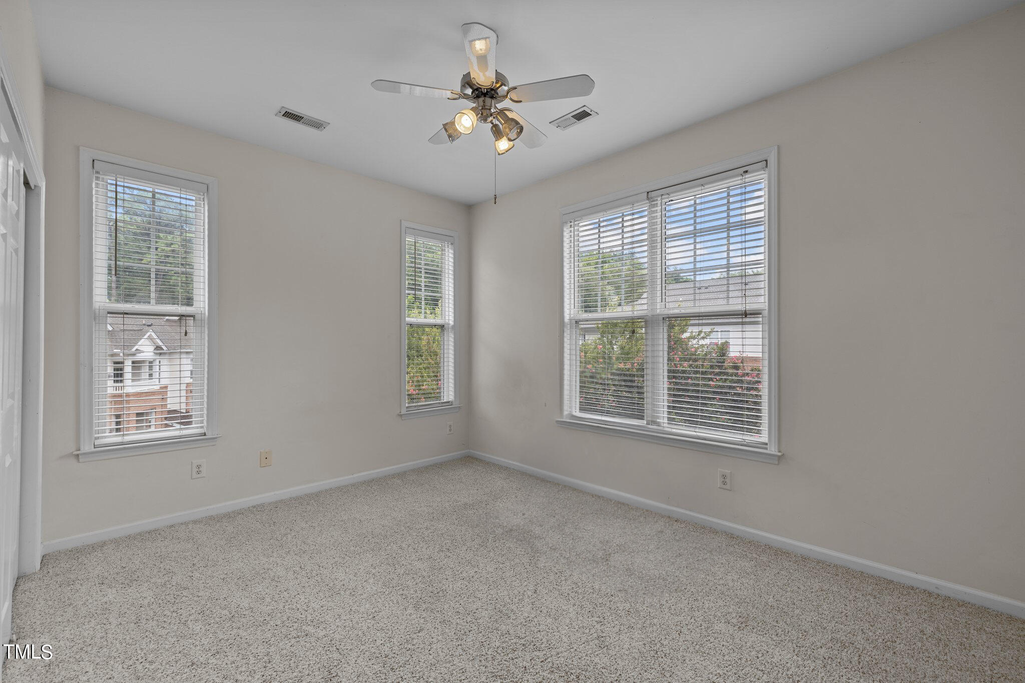 1710 Tiffany Bay Court, Unit 301 Raleigh, NC 27609 - Photo 17 of 36 a view of an empty room with a window