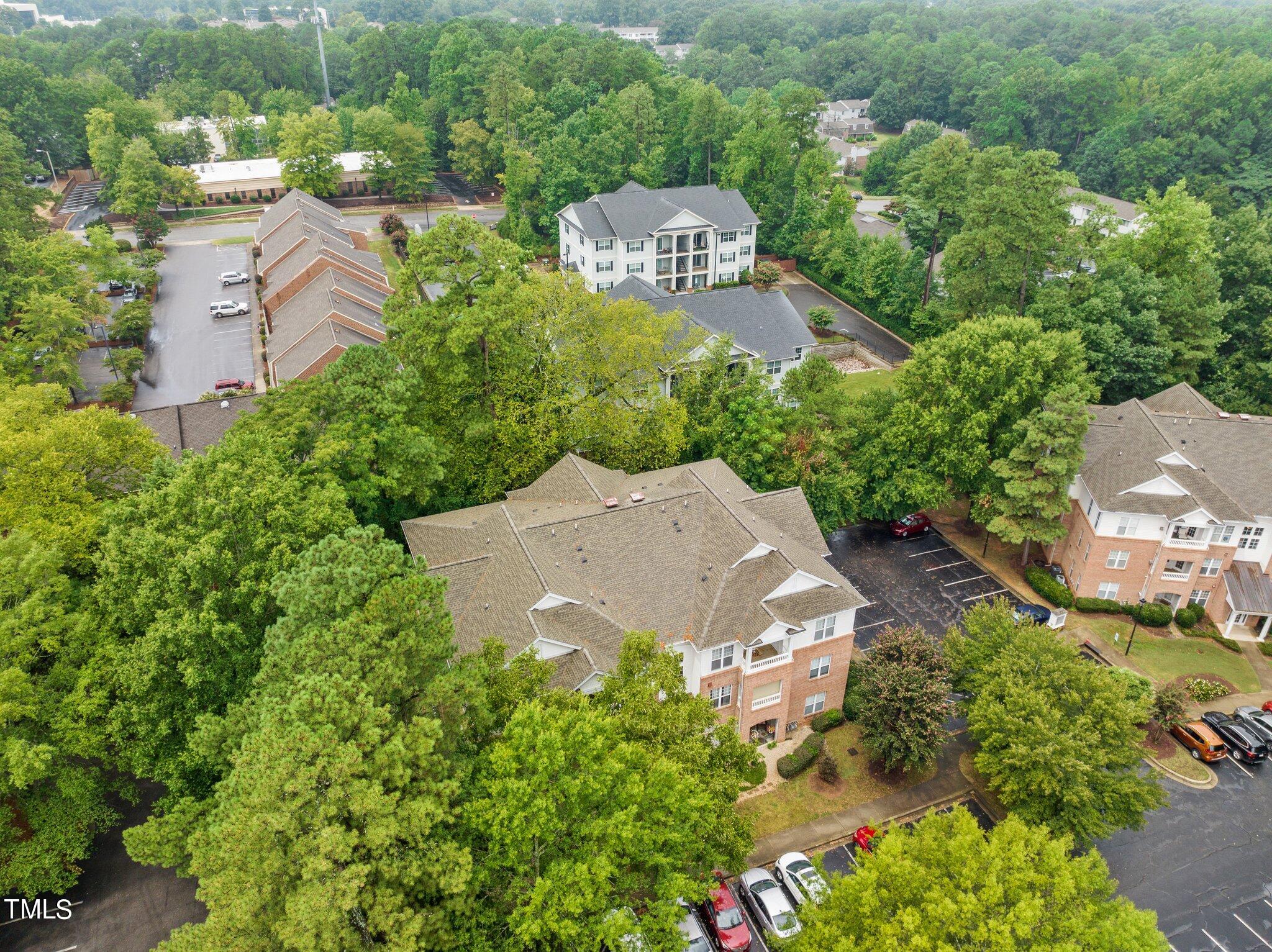1710 Tiffany Bay Court, Unit 301 Raleigh, NC 27609 - Photo 36 of 36 an aerial view of a house with yard swimming pool and outdoor seating