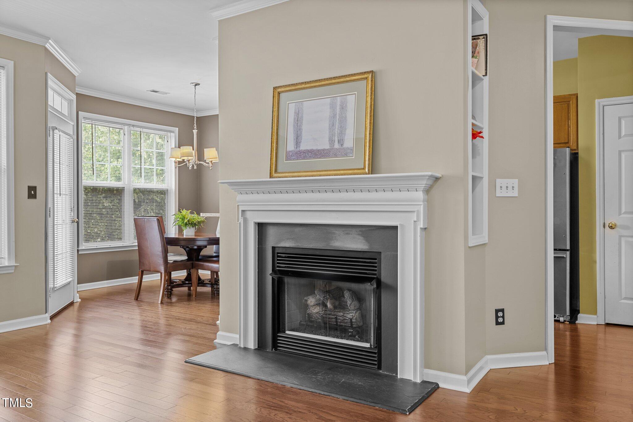 1710 Tiffany Bay Court, Unit 301 Raleigh, NC 27609 - Photo 5 of 36 a living room with furniture and a fireplace
